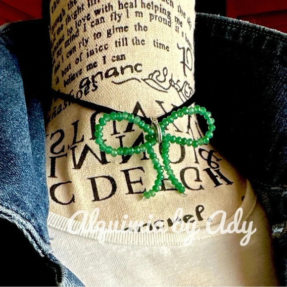 Babydoll choker necklace/untreated emerald suede bow silhouette adjustable fit